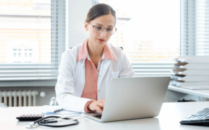 General medical billing person working on computer