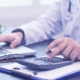 healthcare professional wearing a white coat with stethoscope in hospital