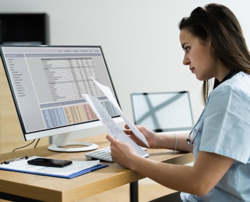 Image of a medical worker reviewing bills.